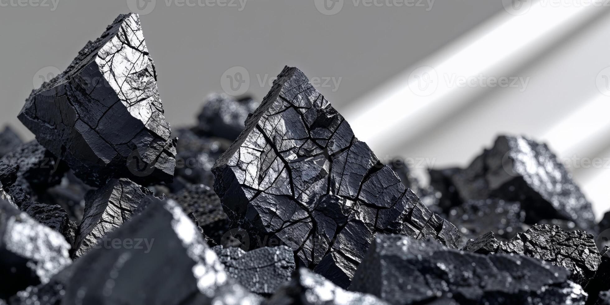 Closeup of jagged black coal pieces with strong texture and sharp geometry photo