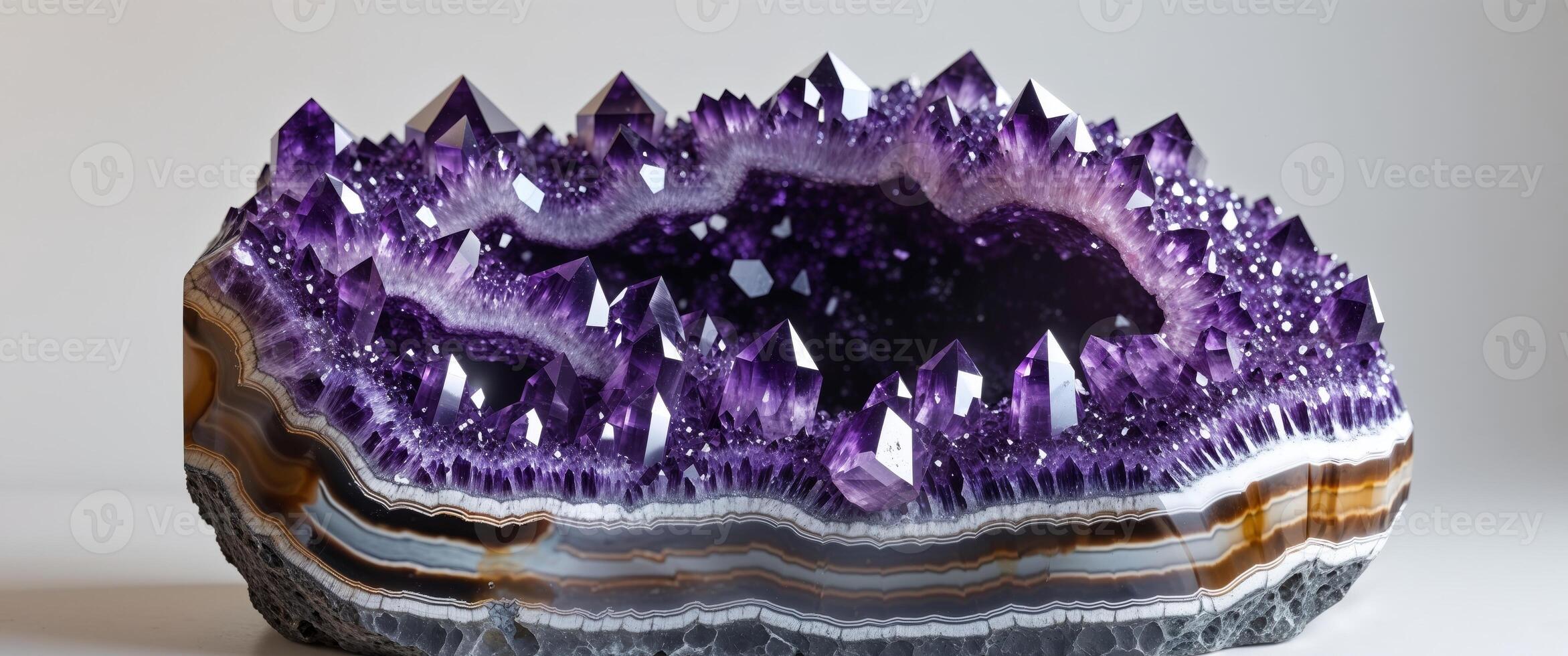 Intricate Amethyst Geode with Purple Crystals and Agate Bands photo