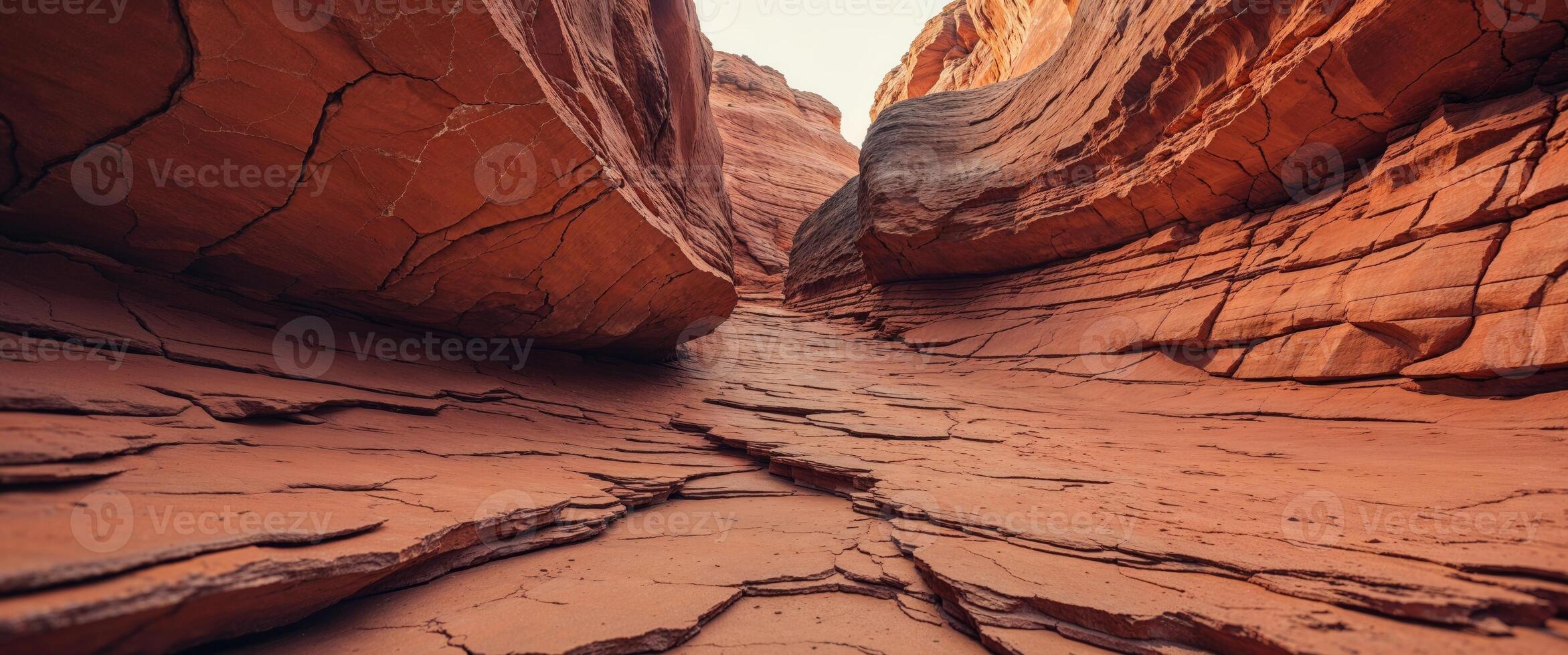 Orange sandstone rock face with natural cracks and layered texture photo