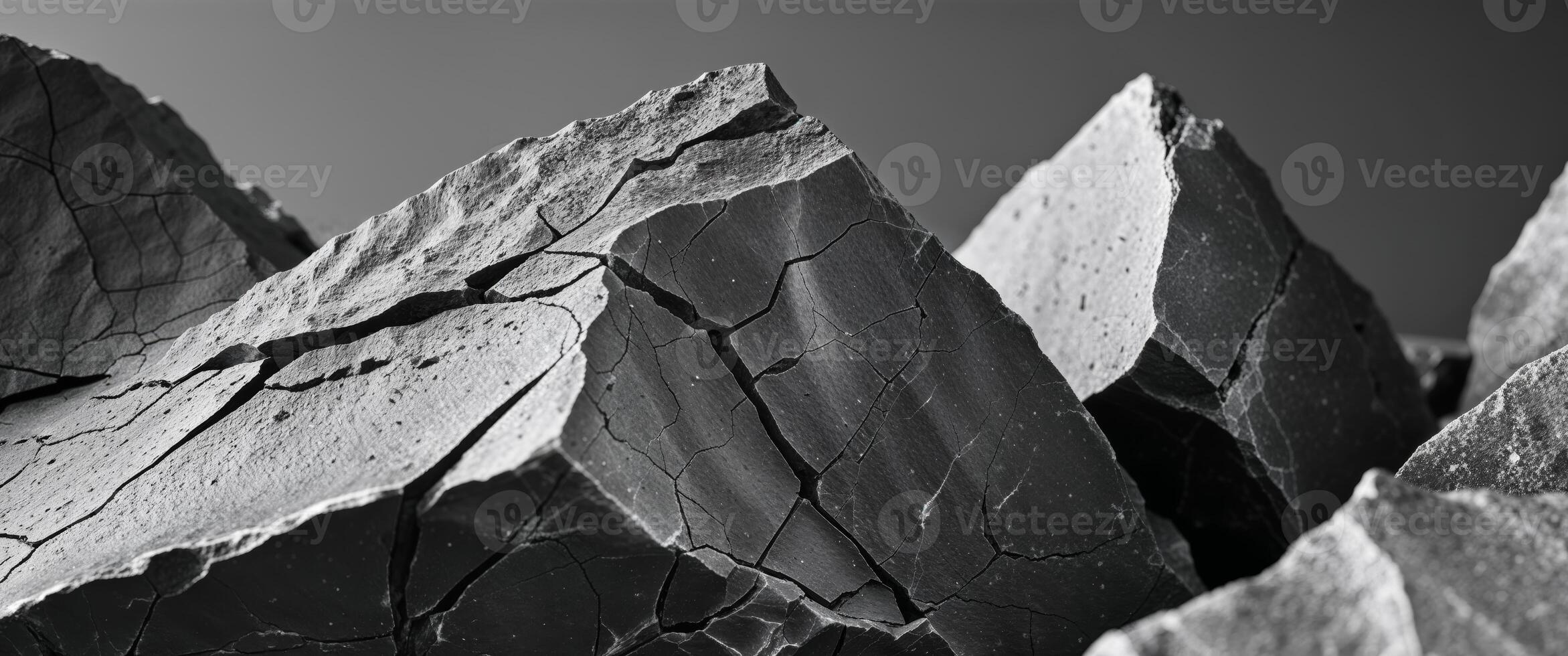 Close up of Sharp Edged Rocks Displaying Cracks and Weathering photo