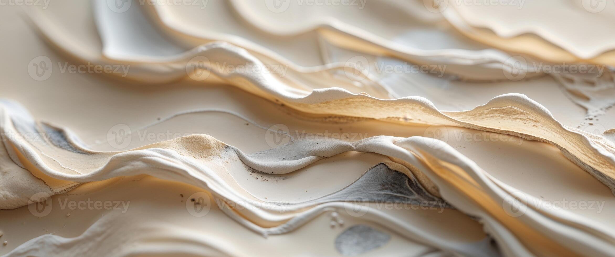 A close up of a white and gold paint photo