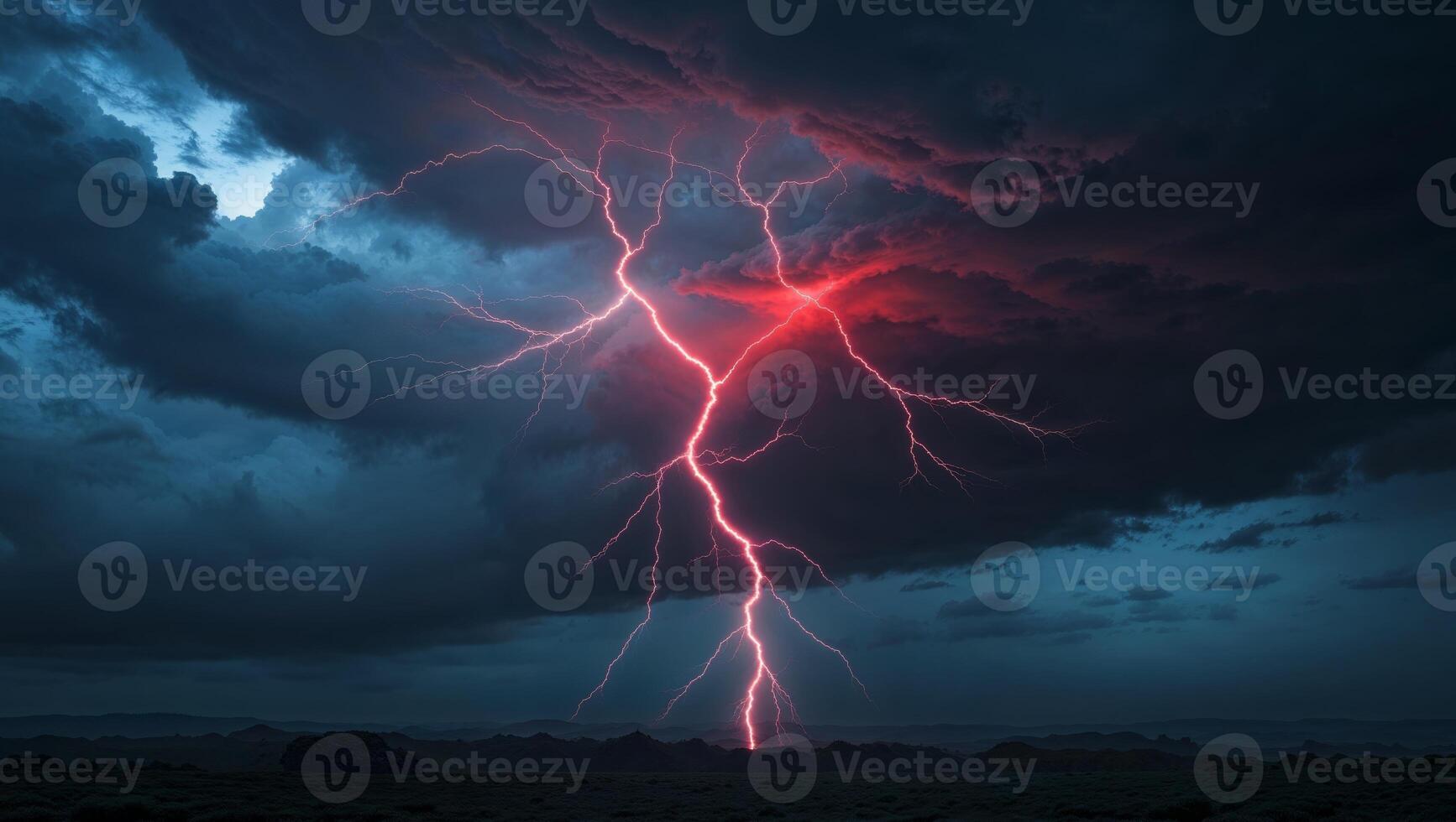 Lightning striking over a dark sky with a red light photo