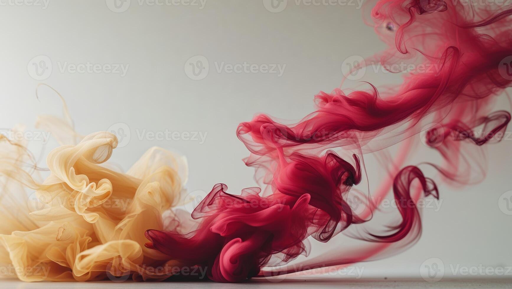 A red and yellow smoke is being blown into the air photo