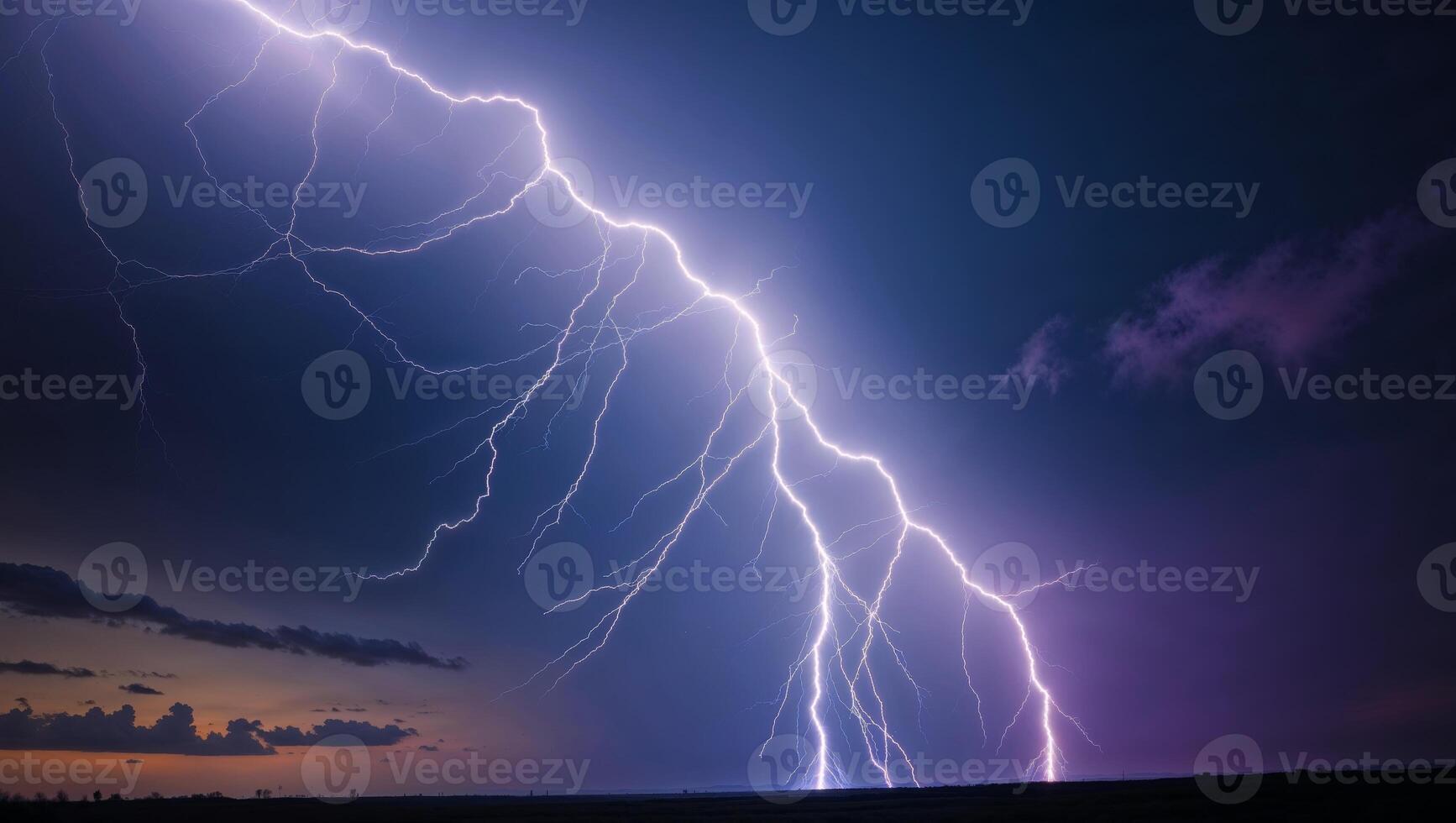 Lightning strikes over a field at dusk photo