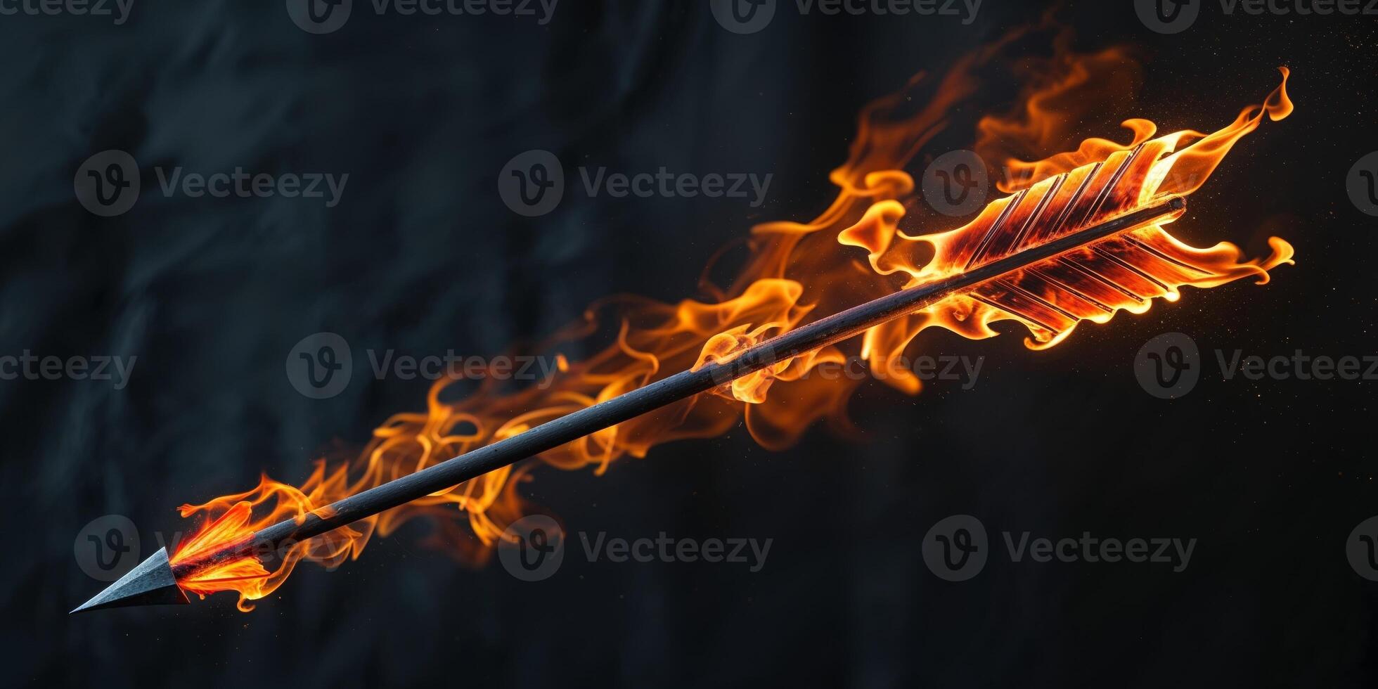 Burning fiery arrow pointing right on dark background photo