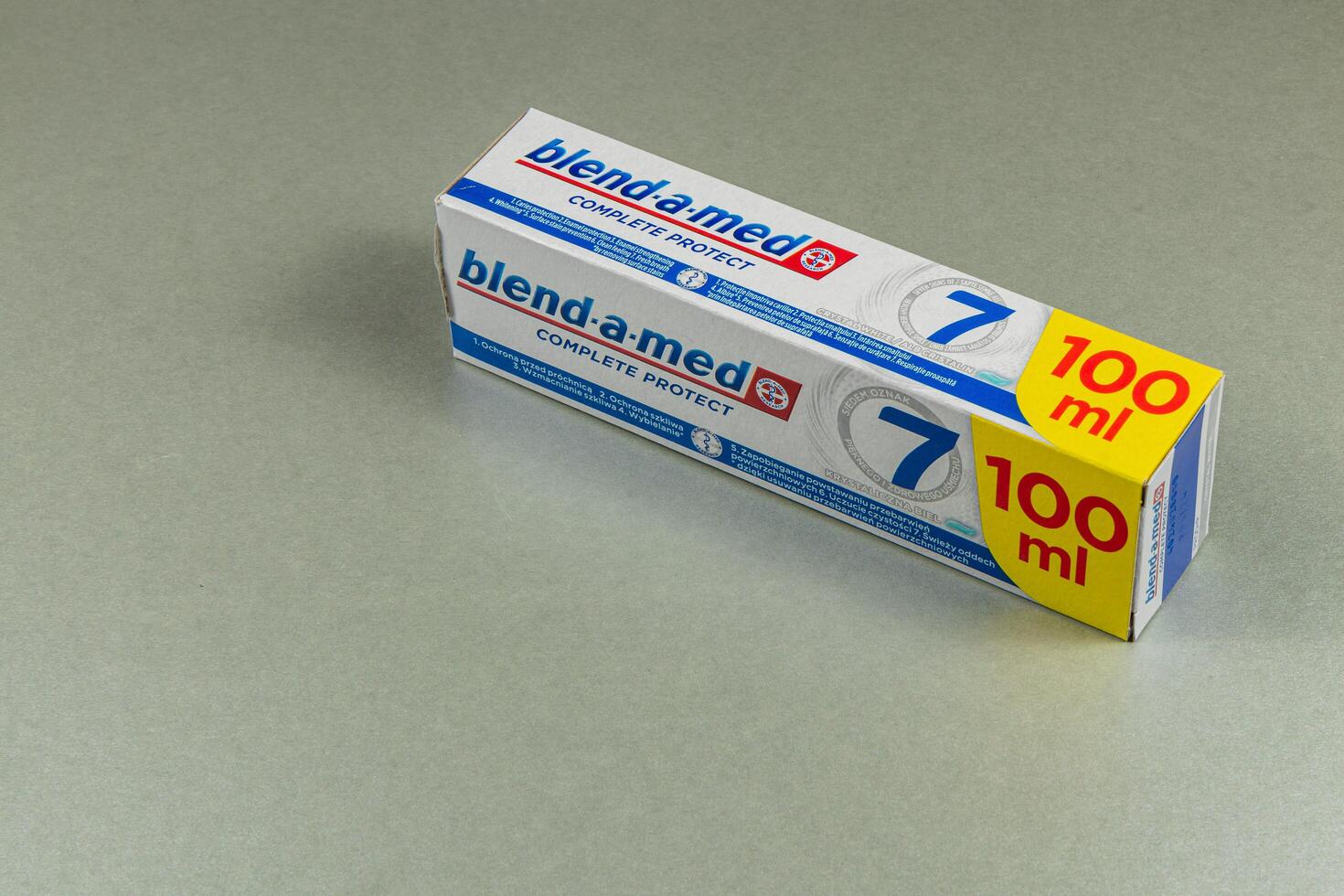 Lviv Ukraine 05.04.25 Toothpaste box placed on a gray surface indoors photo