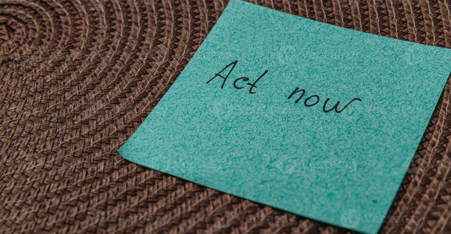 Reminder note on a textured surface encouraging immediate action photo