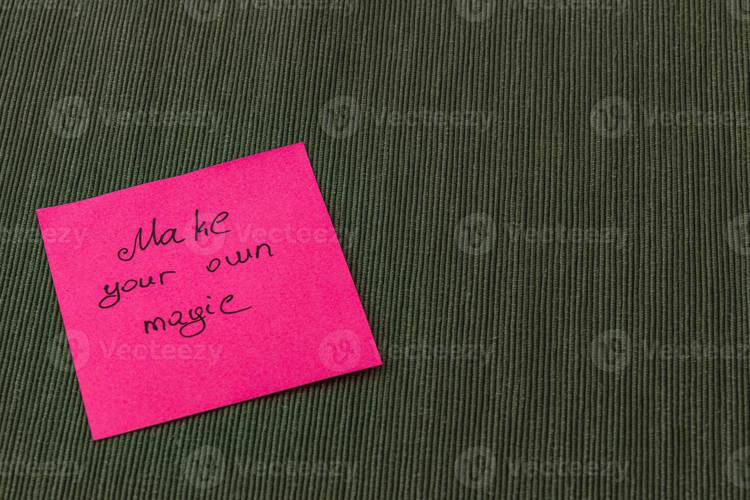 Create your own inspiration with a colorful sticky note on a warm backdrop photo
