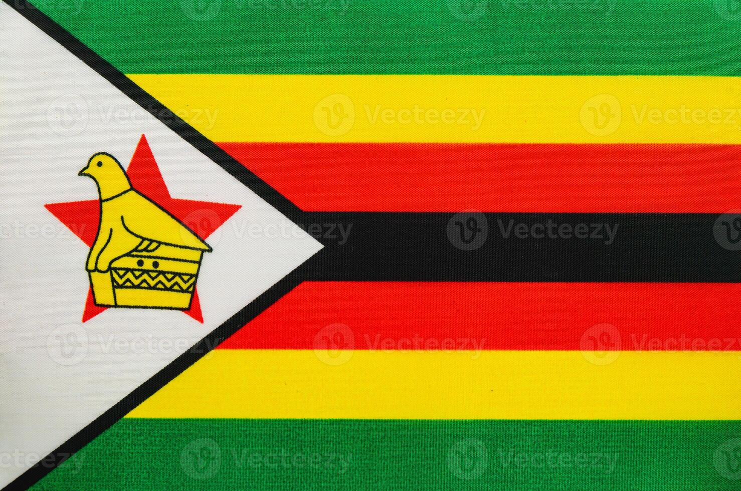 Zimbabwe flag featuring national emblem and vibrant colors photo