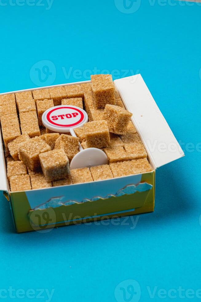 Sugar cube box with a stop sign and vibrant background setting photo