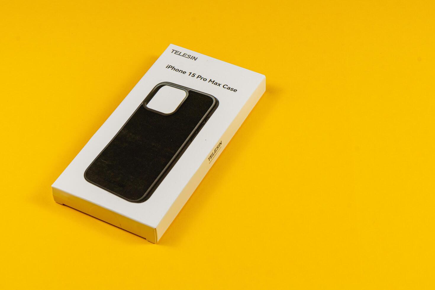 Lviv Ukraine 05.04.25 Black iPhone 15 Pro Max case on yellow background photo