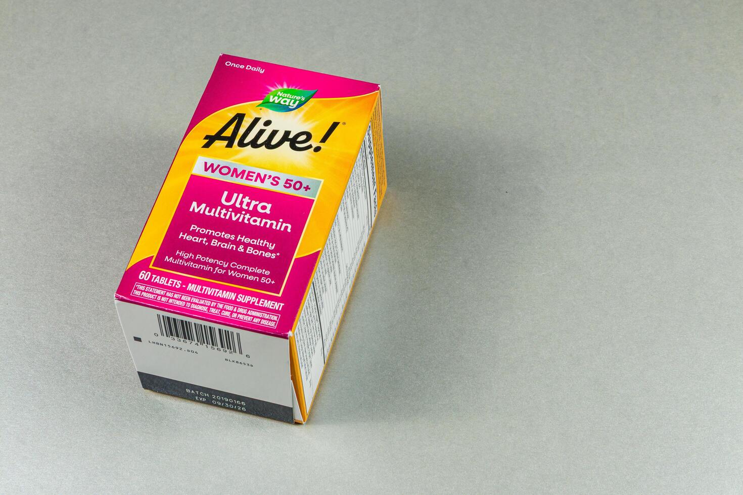 Lviv Ukraine 10.04.25 Women's multivitamin box on gray surface photo