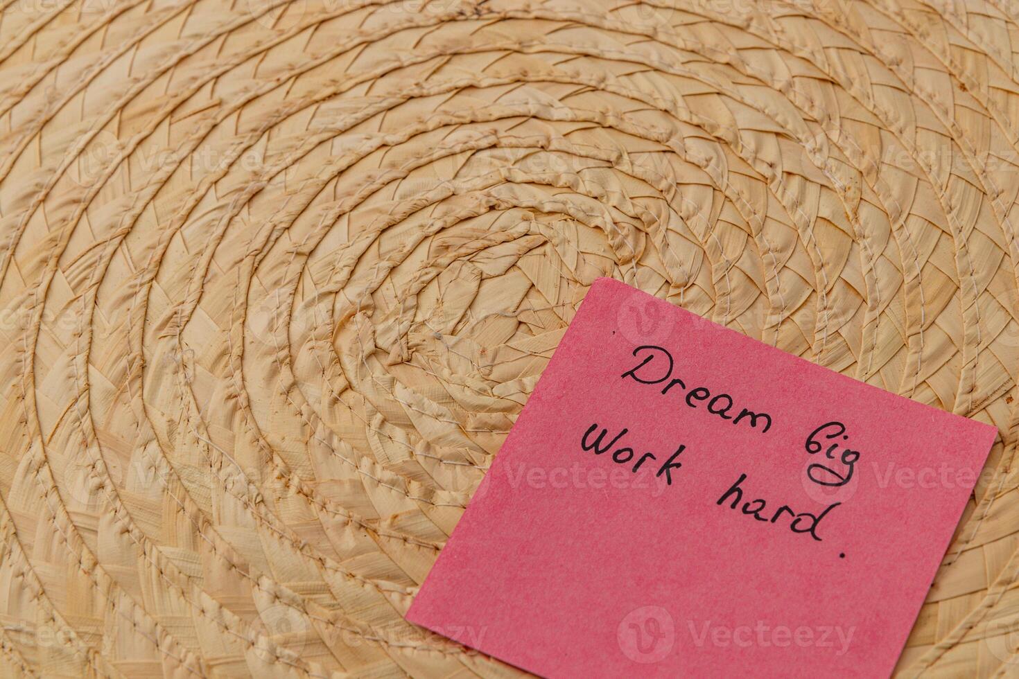 Inspiring message on colorful sticky note beside woven basket photo