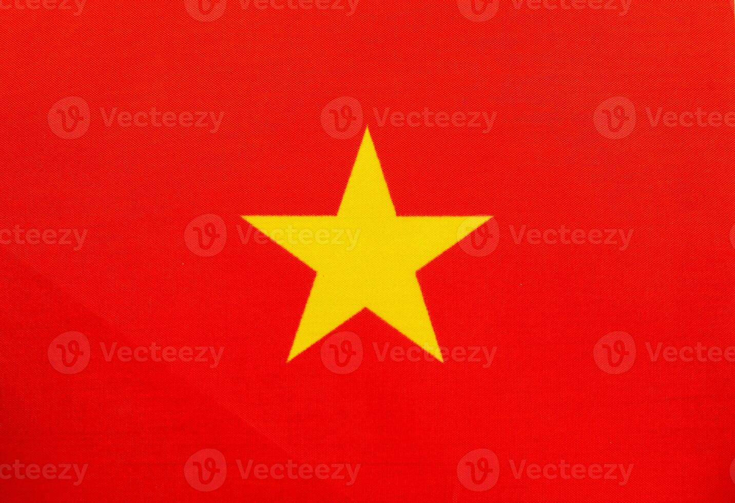 National flag of Vietnam with red background and yellow star photo