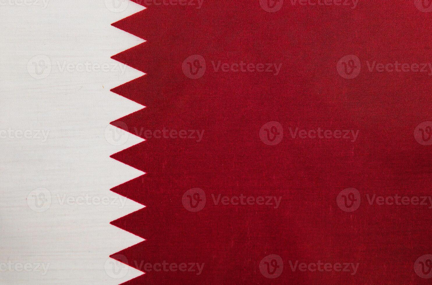 Qatar flag displayed prominently in a colorful setting photo