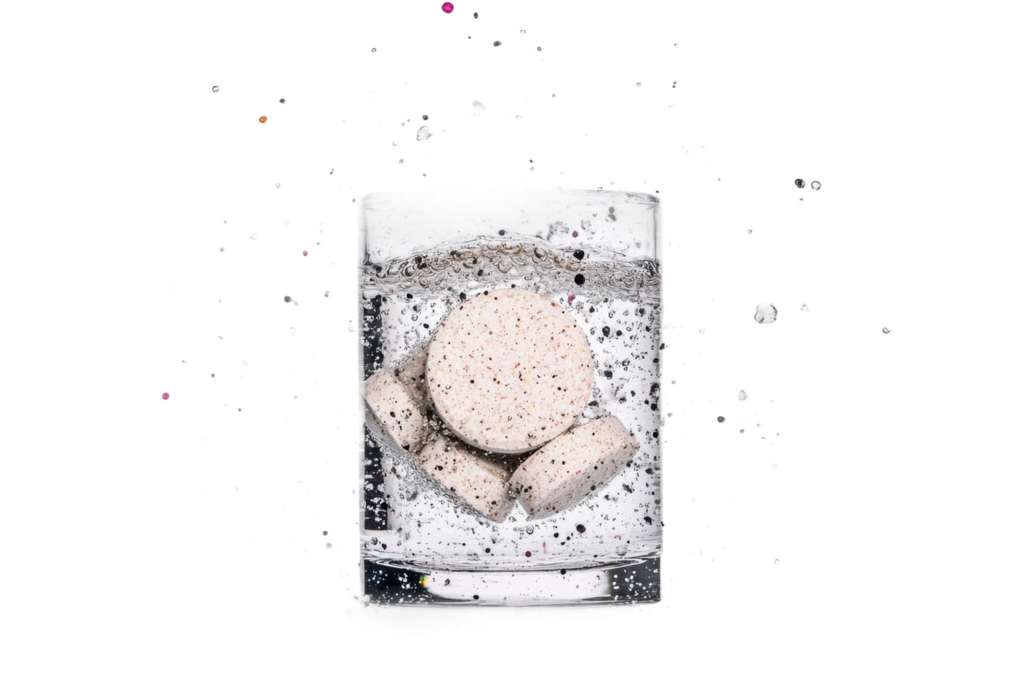 Effervescent tablets dissolving in a glass of water with splashing effect png