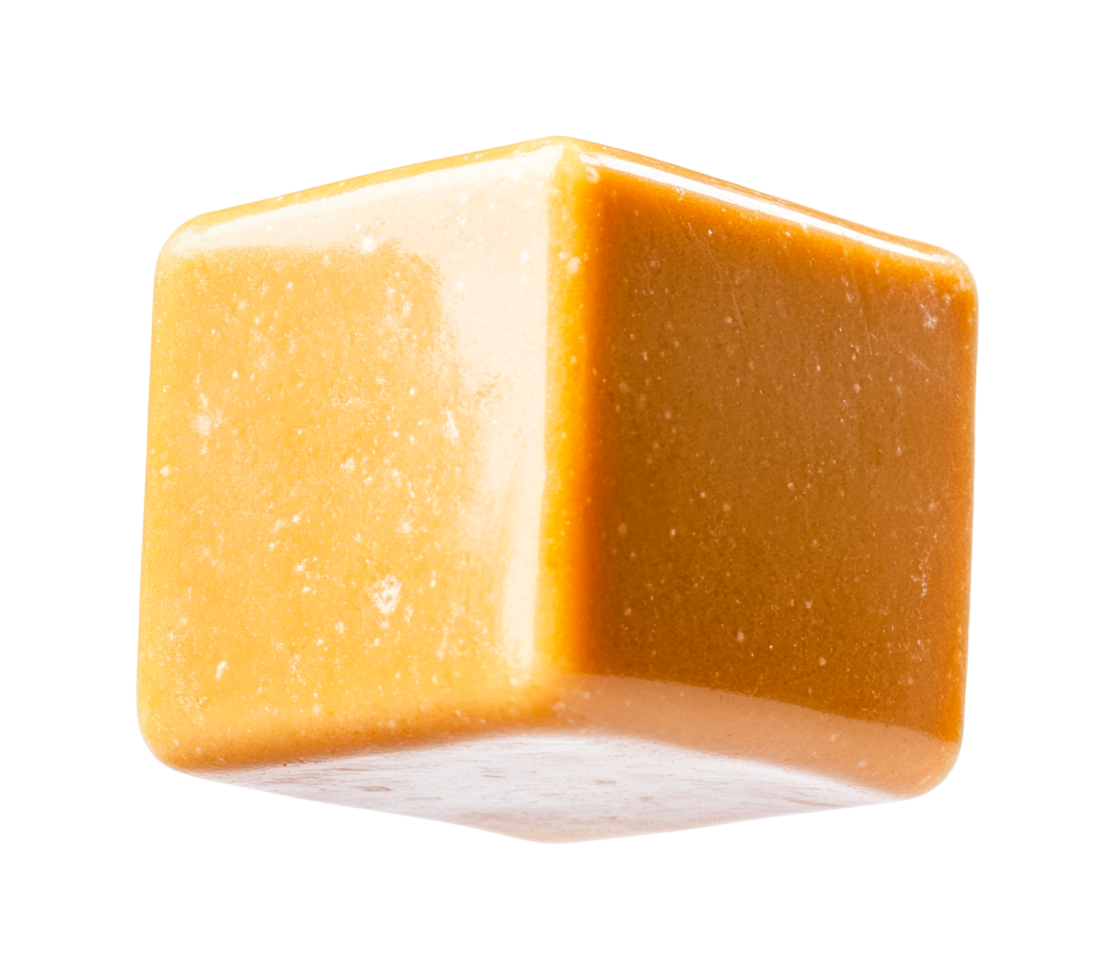 Floating caramel candy cube isolated on black background png