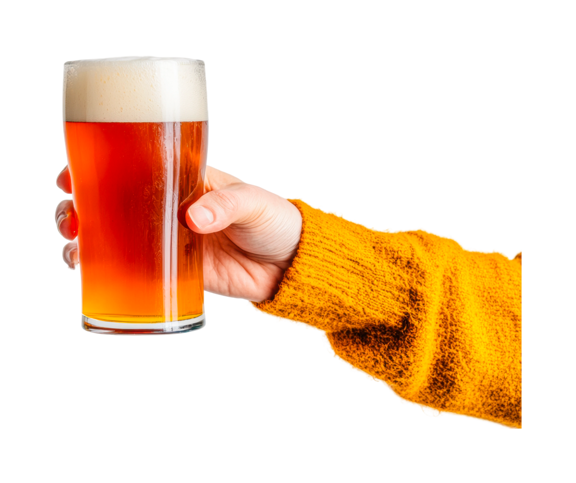 Caucasian female hand holding a glass of amber beer with foam png