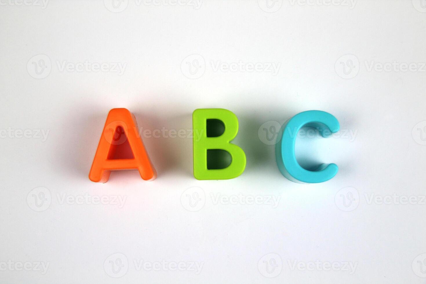 Bright and colorful letters of the English alphabet on a white background. Learning concept photo