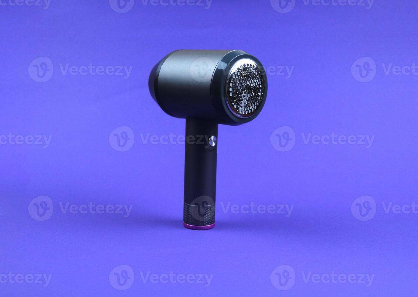 Close-up of a lint removal machine blade on a purple background photo