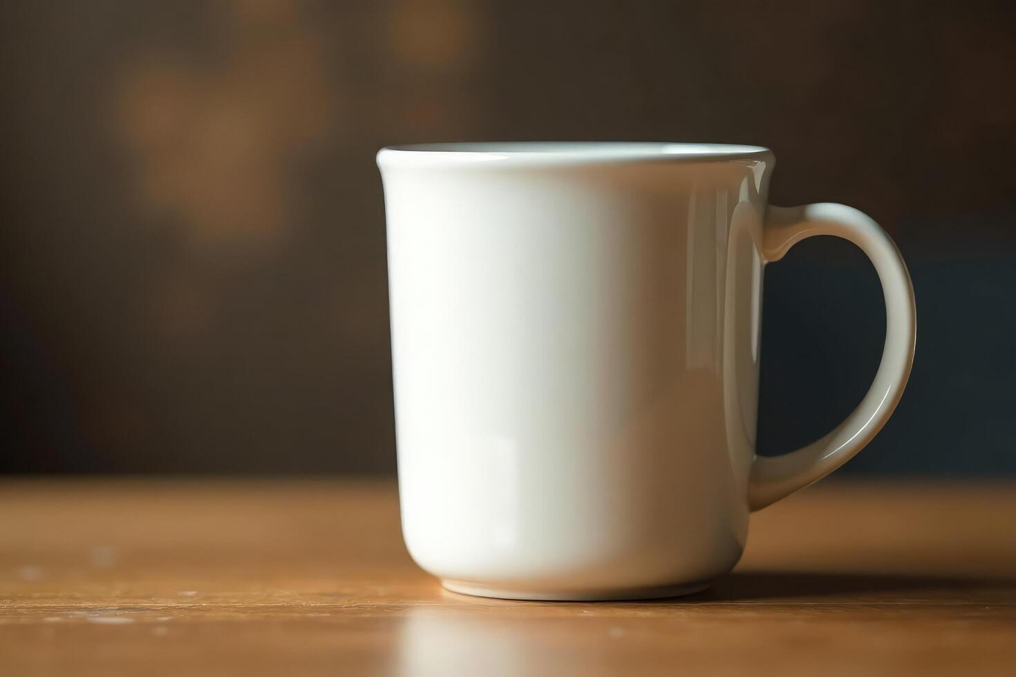 A white coffee cup sitting on a wooden table photo