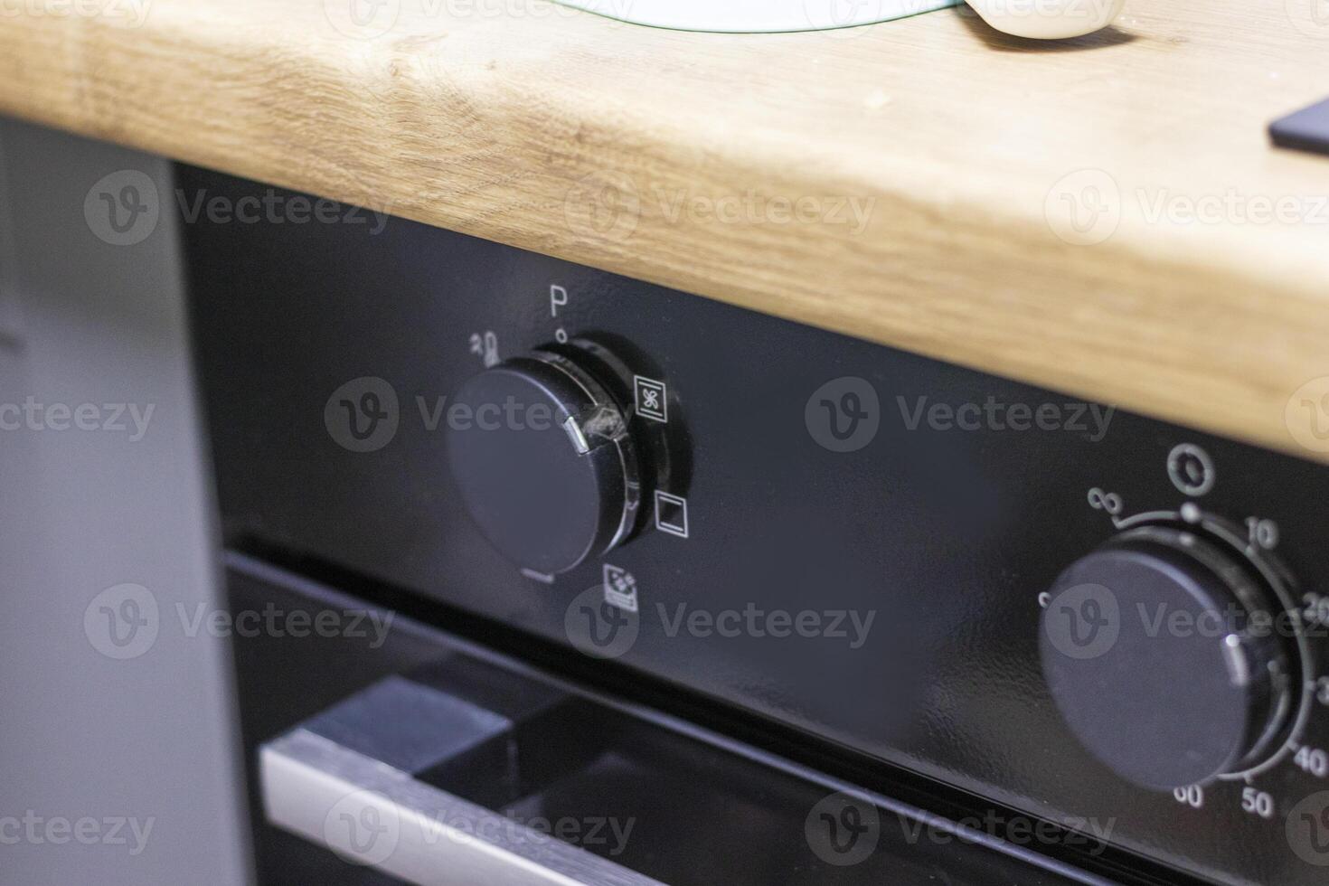 Close up of the timer and mode relays of the oven. Appliance photo