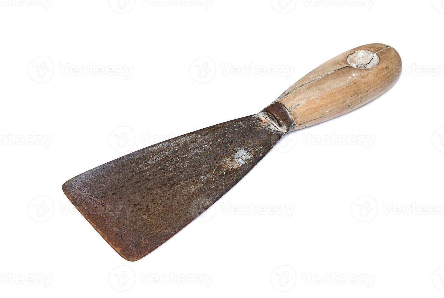 Old rusty spatula on a white background photo