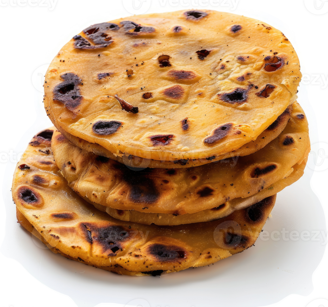 A stack of golden-brown, cooked flatbreads with browned edges. png