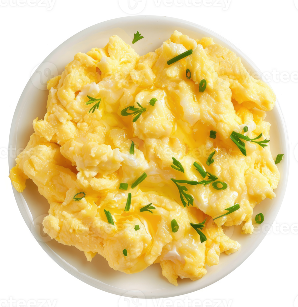 Scrambled eggs with chives and butter on a plate. png