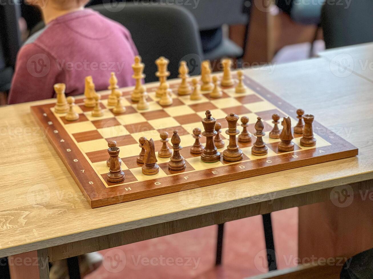 Chessboard with figures during a chess tournament in a school photo