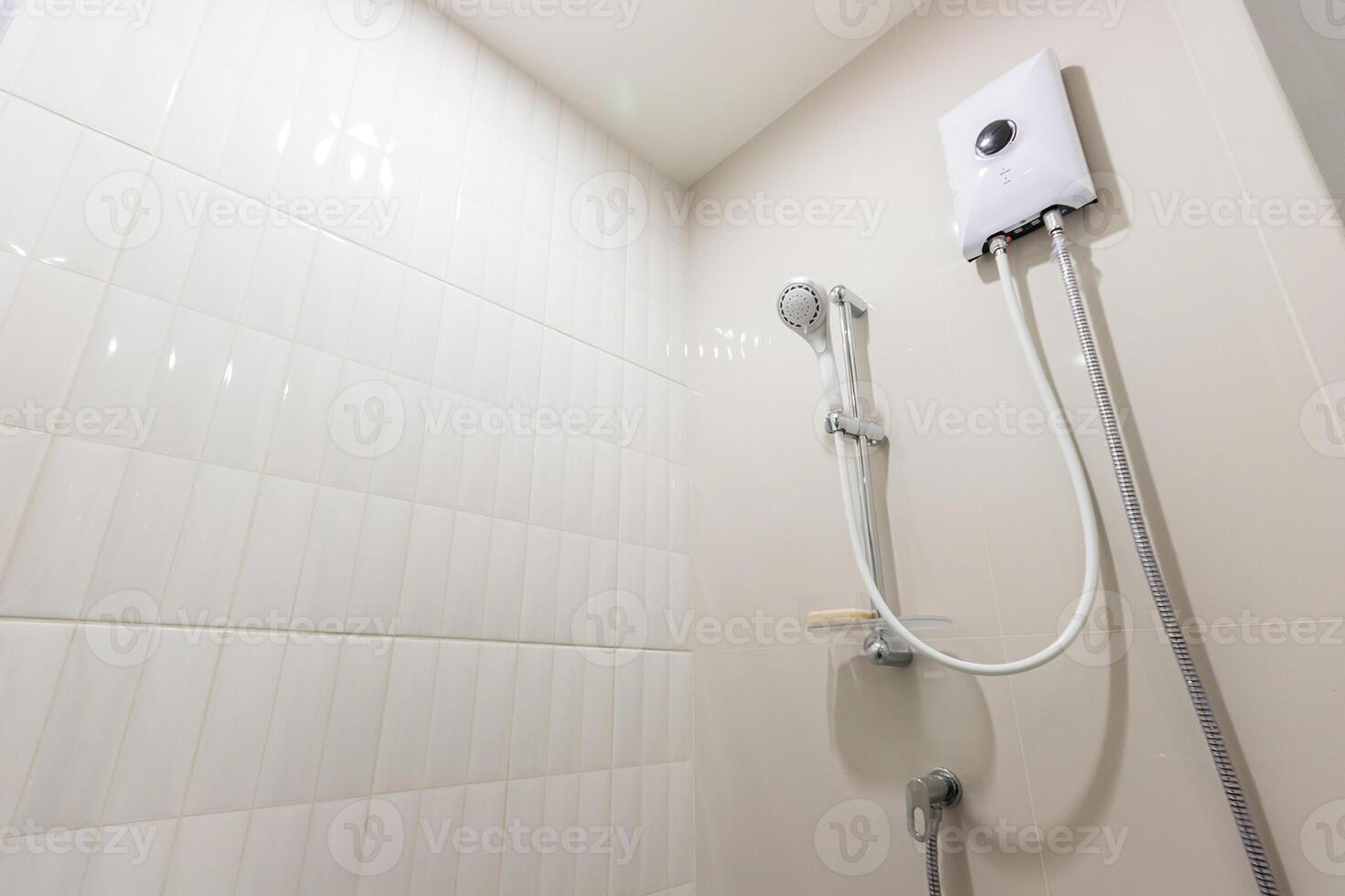 A shower head with a hose attached to it photo