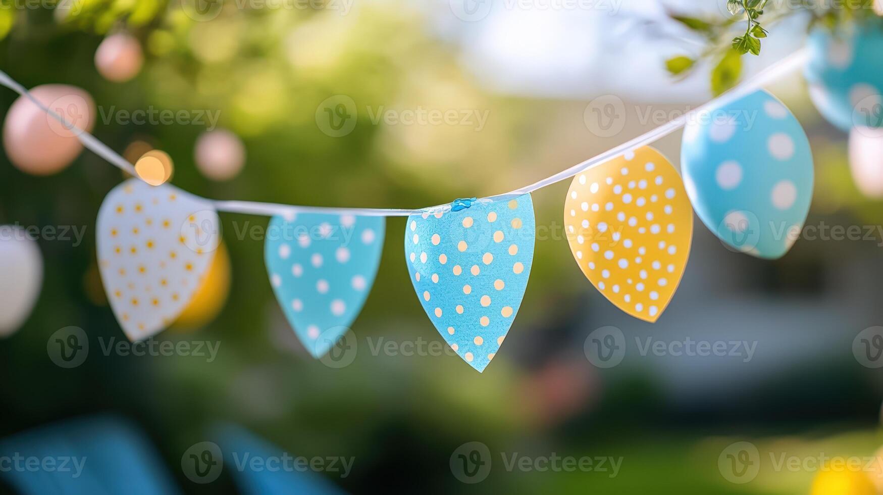 Festive Bunting Garland with Polka Dots Hanging Outdoors for Celebration, Bright and Cheerful. photo