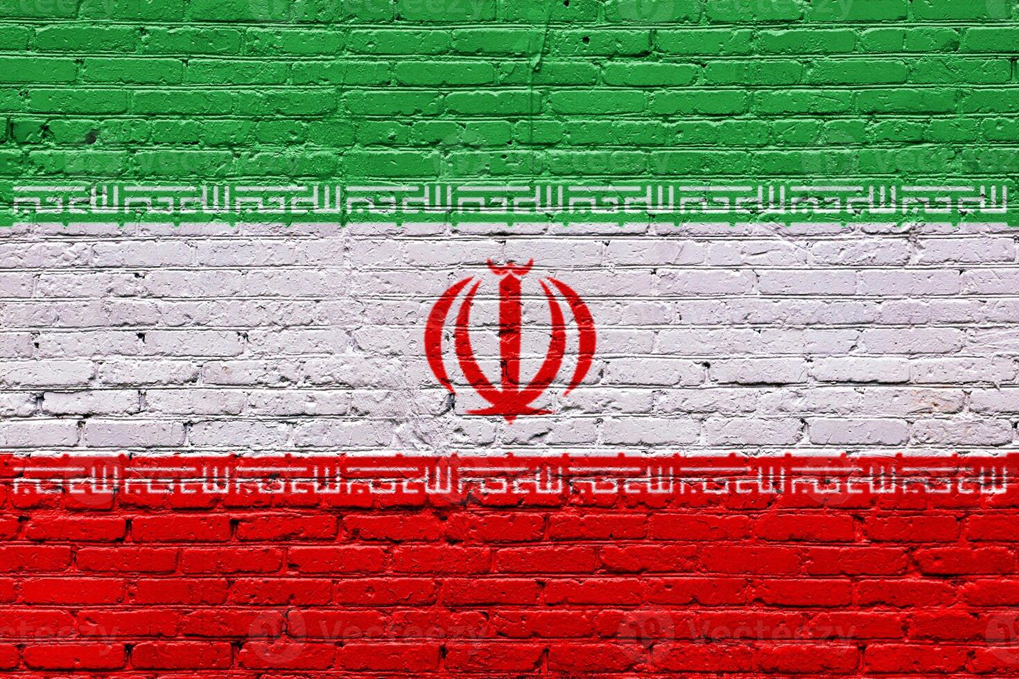 Flags of Iran on a textured brick wall with graffiti and urban art elements photo