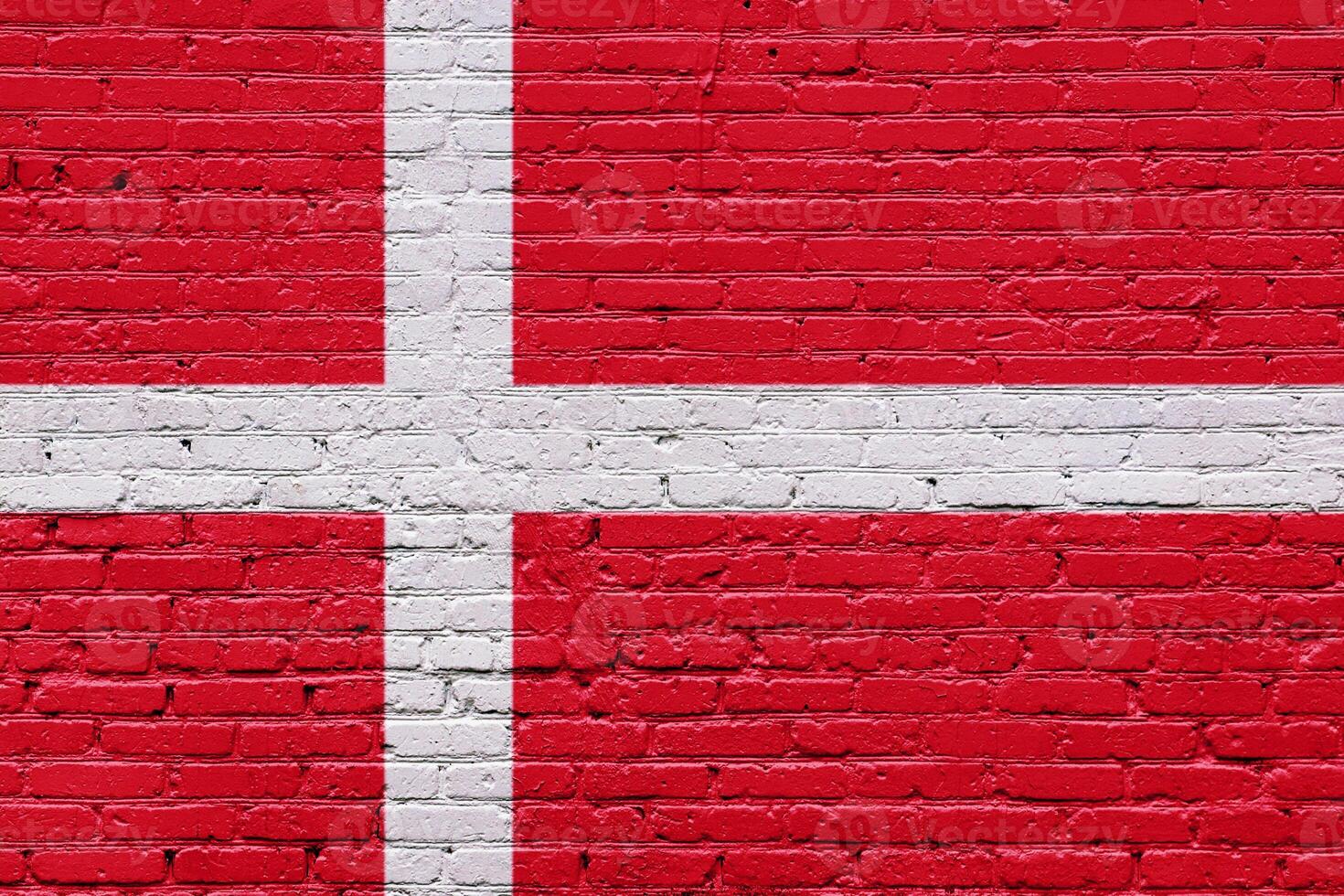 A collection of European national flags including Denmark, displayed on a textured brick wall with a patriotic and grunge aesthetic photo