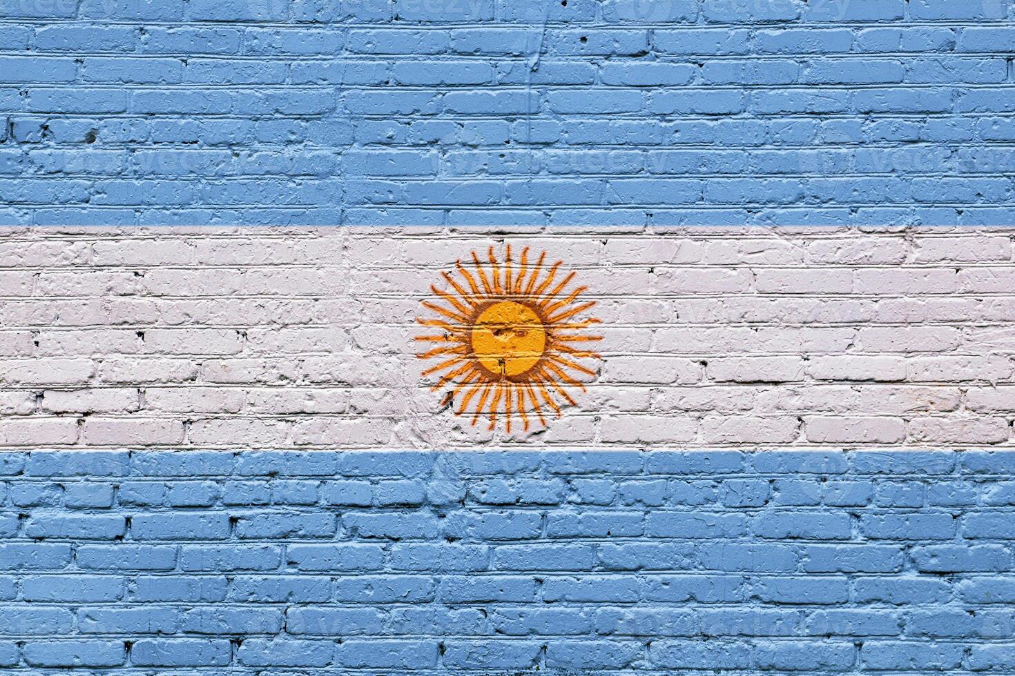 Argentina flag on a textured brick wall with vintage and grunge details photo
