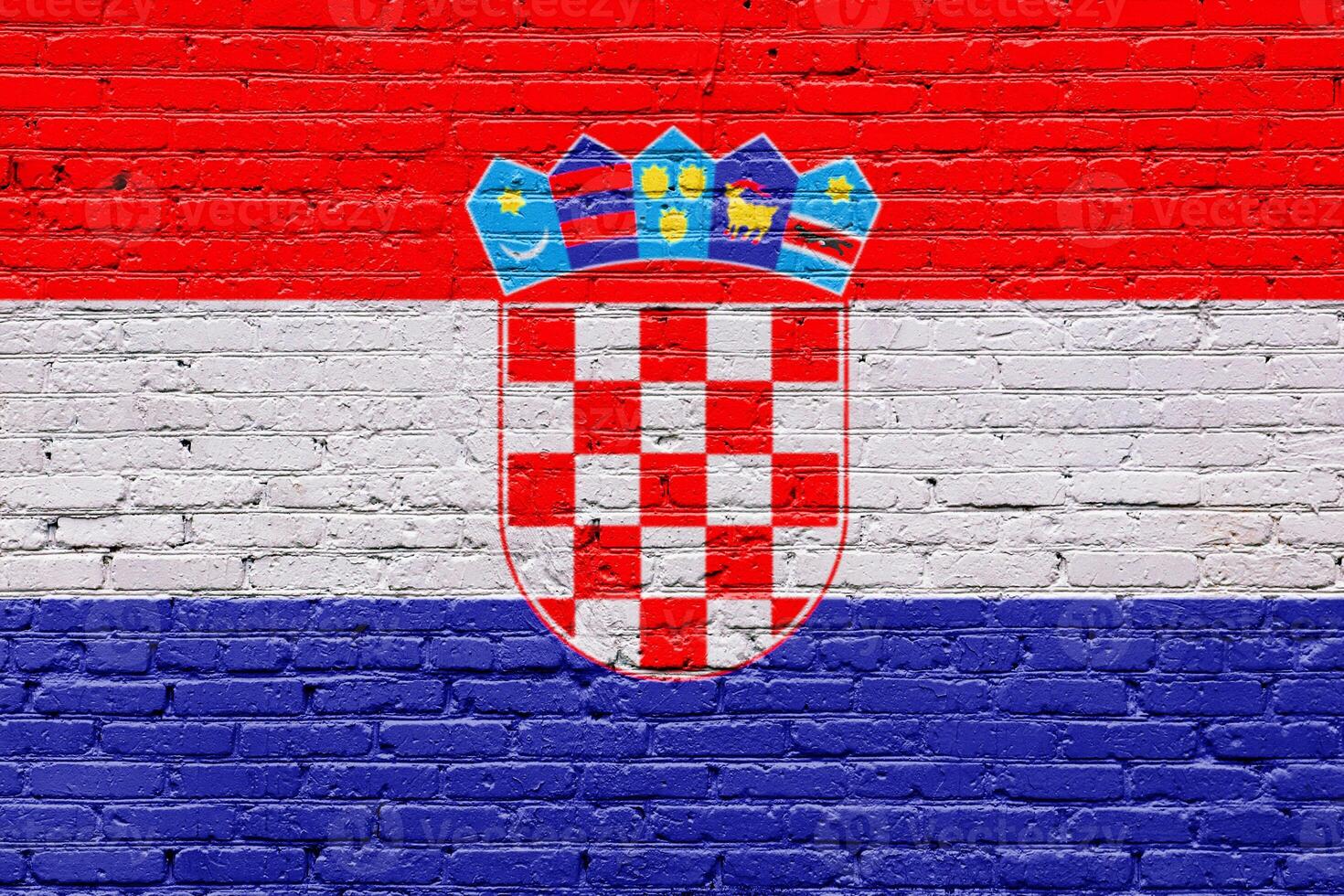 croatia flag painted on a wooden tag with a patriotic, grunge texture on a brick wall photo