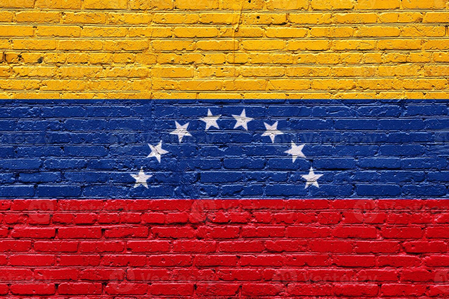 Grunge wall with abstract brick texture featuring the flags of venezuela , symbolizing national identity with rough, aged patterns and a mix of white, red, and other solid colors photo