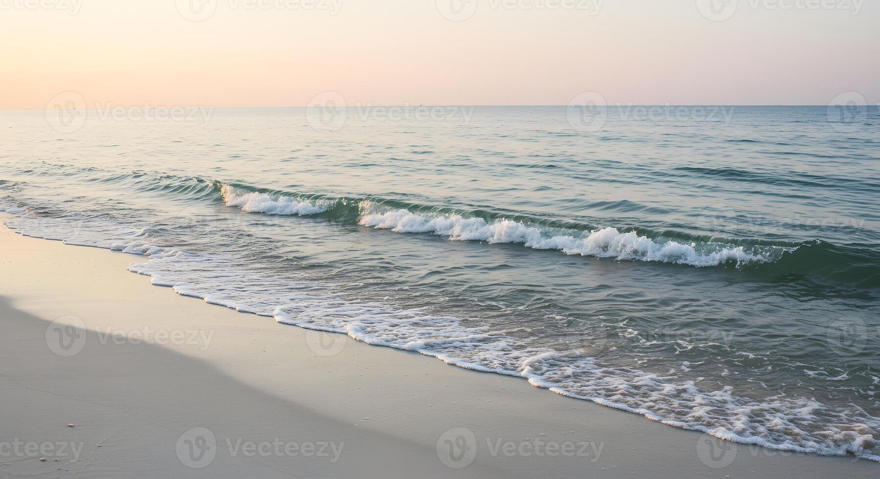 Serene Coastal Sunrise Gentle Waves on Sandy Beach photo
