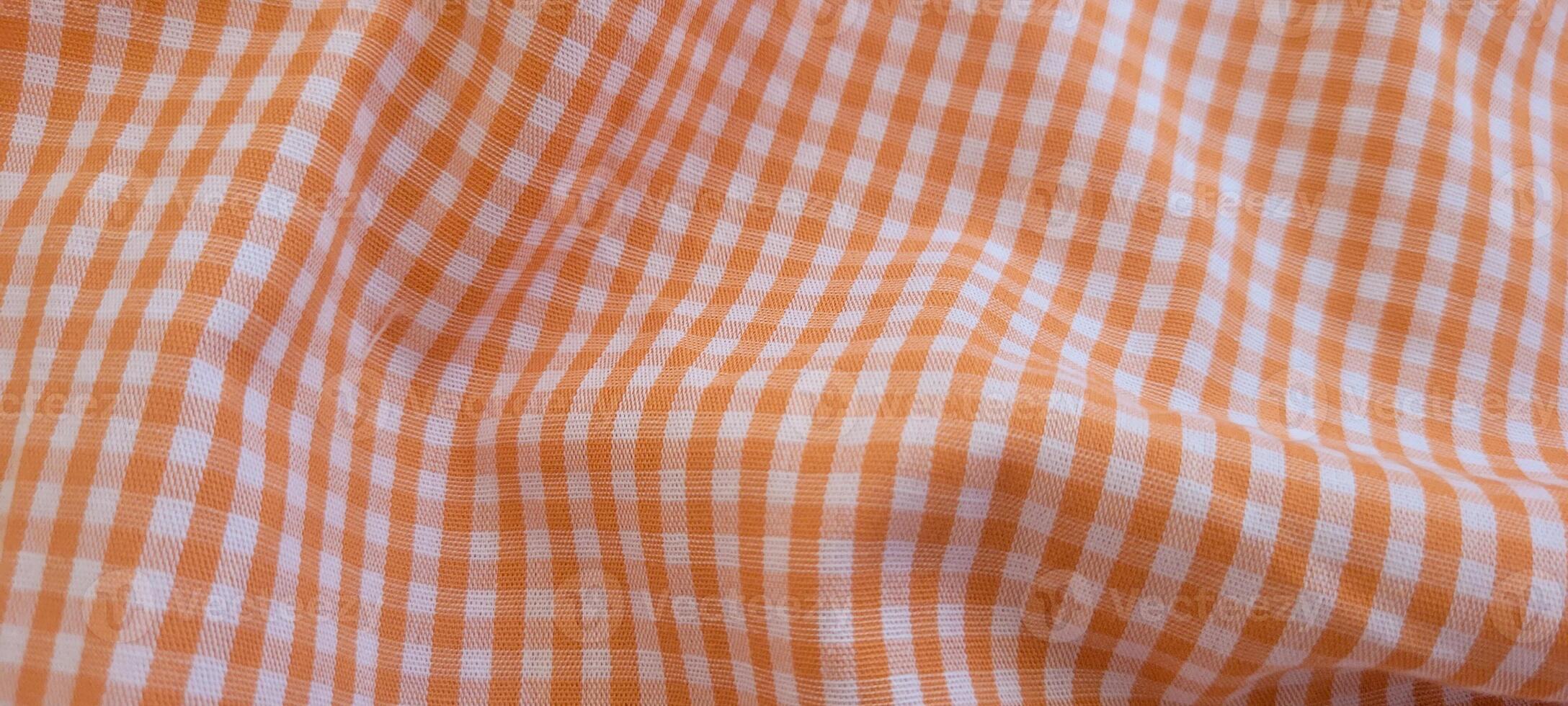 checkered picnic blanket fluttering on a sunny day photo