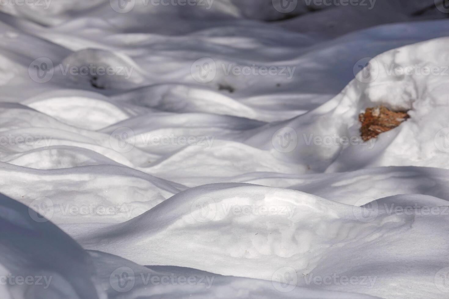 Wind sculpted patterns on snow surface. Nature photo