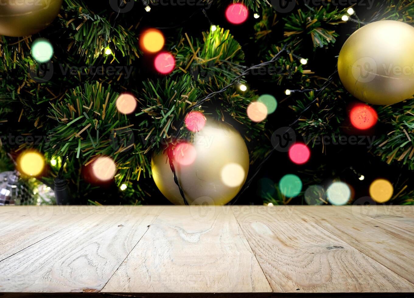 Empty old wooden table in front of Christmas or happy new year time background photo