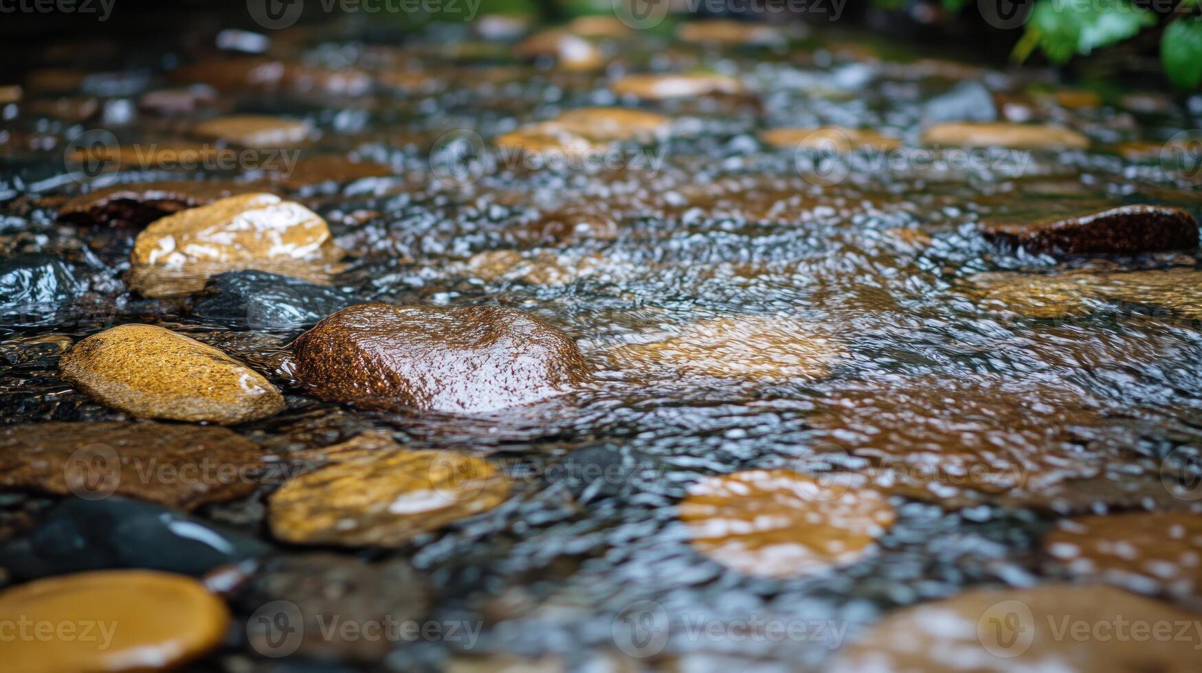 A serene stream with smooth, colorful pebbles. photo