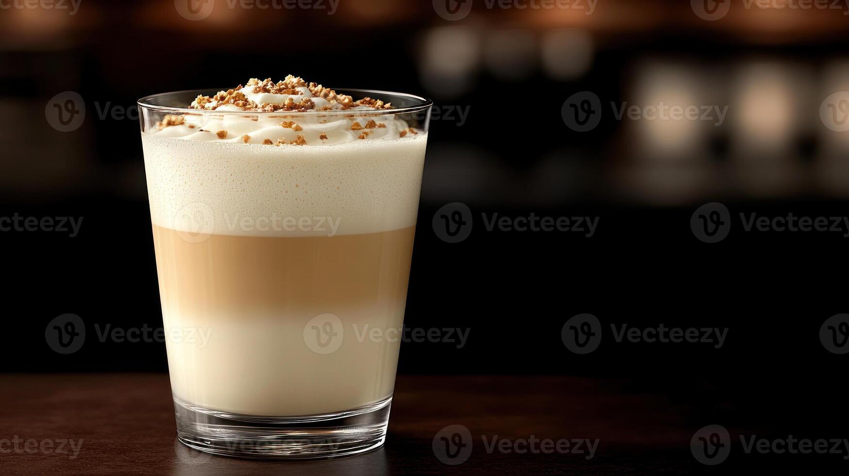 Creamy layered beverage topped with nuts. photo