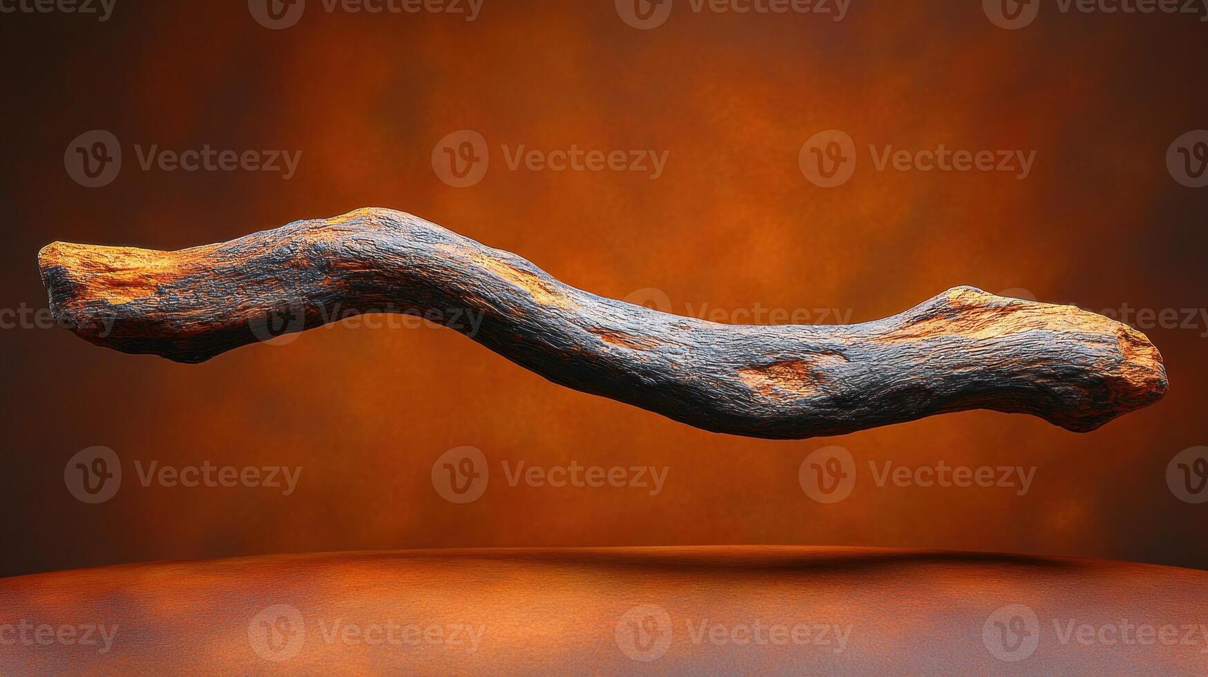 A textured, floating stick against a warm background. photo