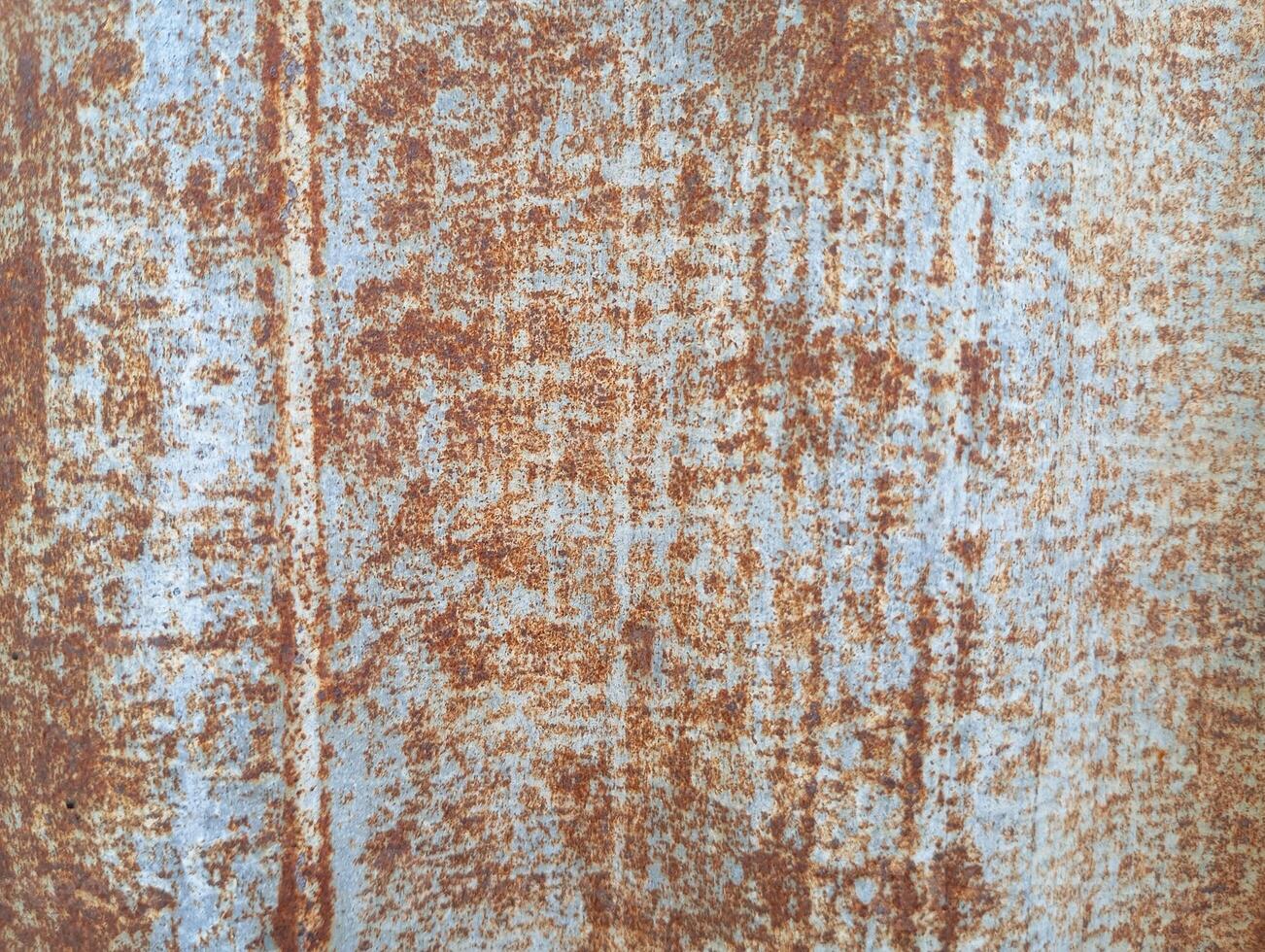 Rusty Metal Surface Texture. This is a close-up of a weathered metal surface with rust forming an organic, abstract pattern. photo