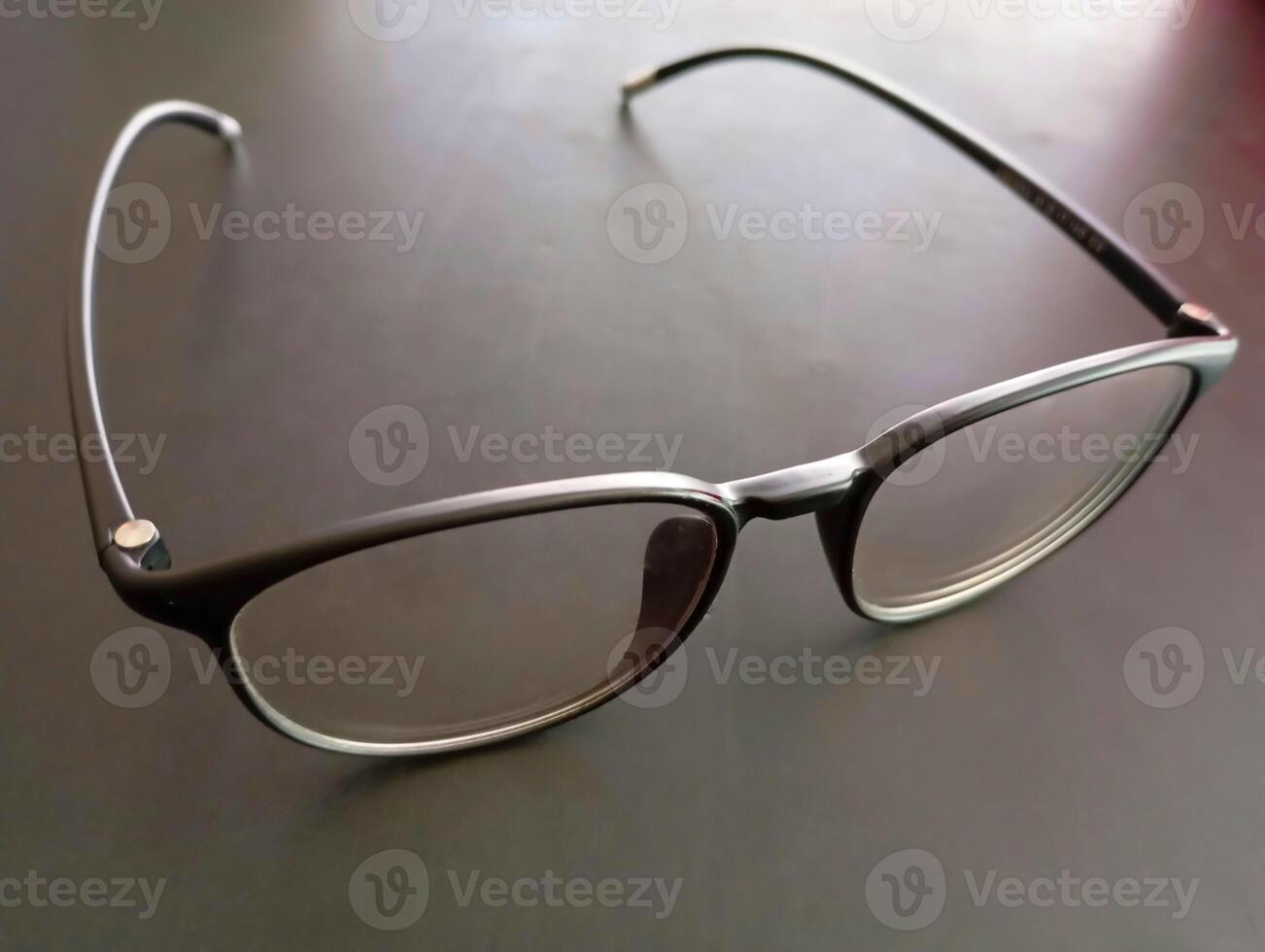 Classic Black Frame Reading Glasses. These glasses feature a sleek, classic black frame with clear lenses for reading. photo