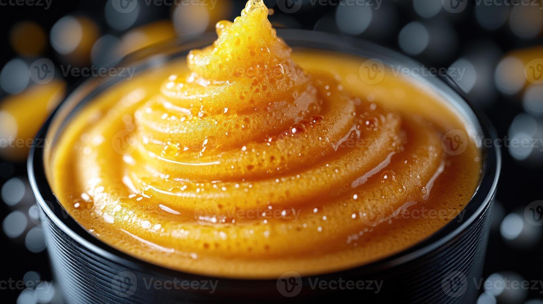 Creamy orange sauce in a dark setting. photo