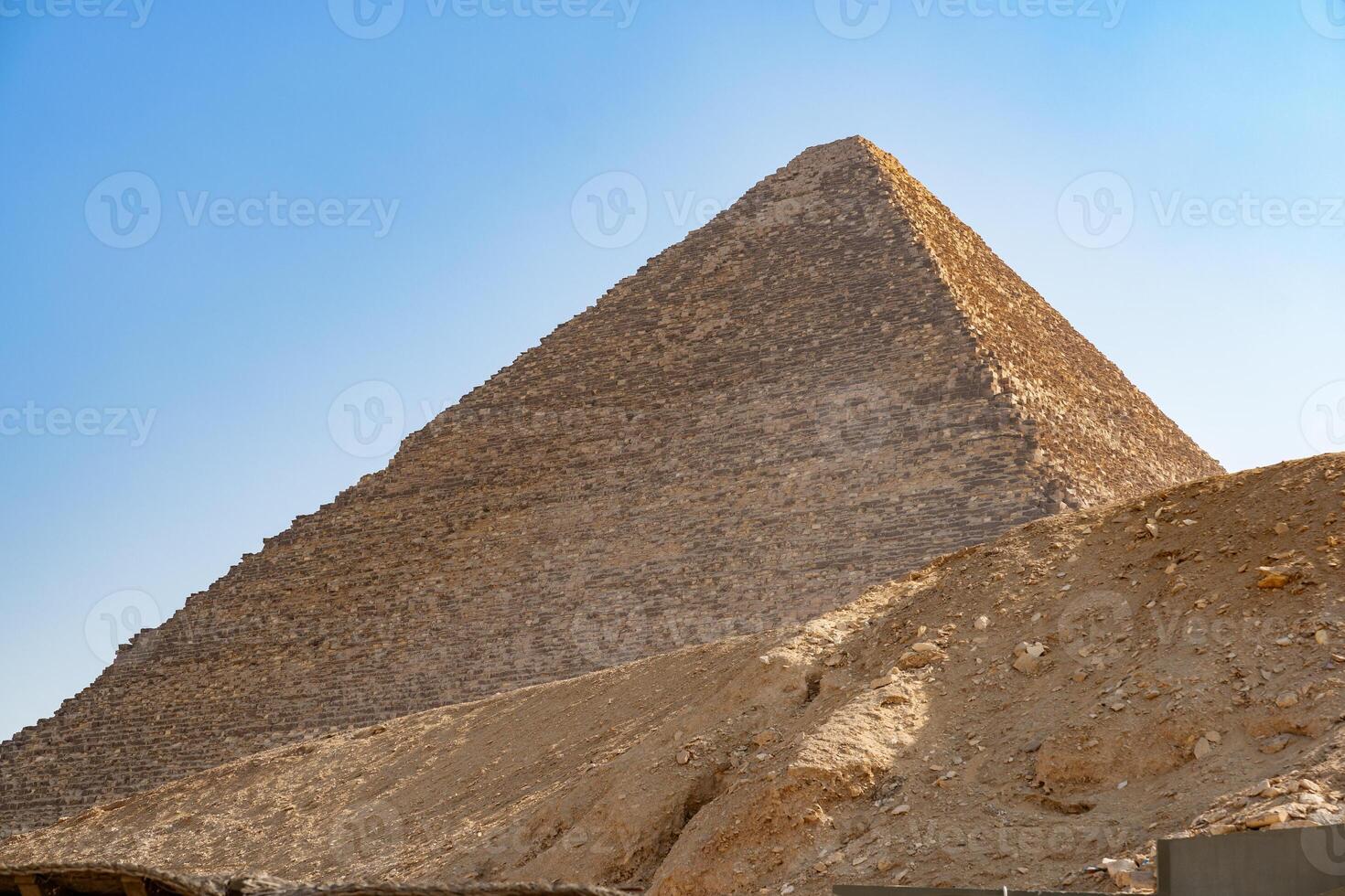 Exploring the Great Pyramid of Giza in Egypt under a clear blue sky during daylight hours photo
