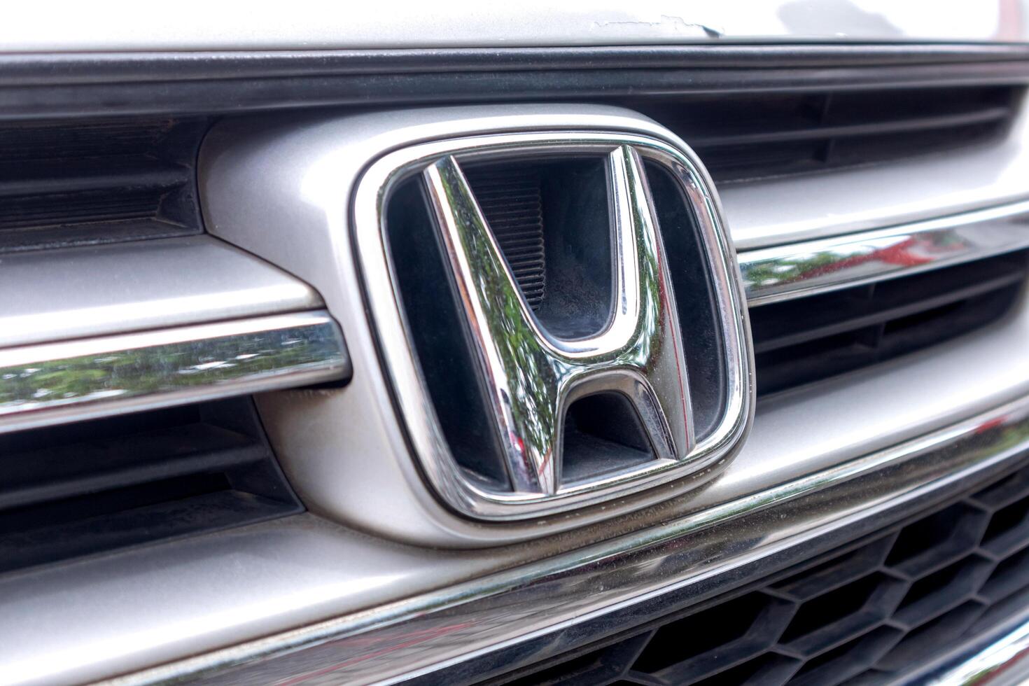 Riau, Indonesia, 2025 - Honda logo emblem on the front of the silver car photo