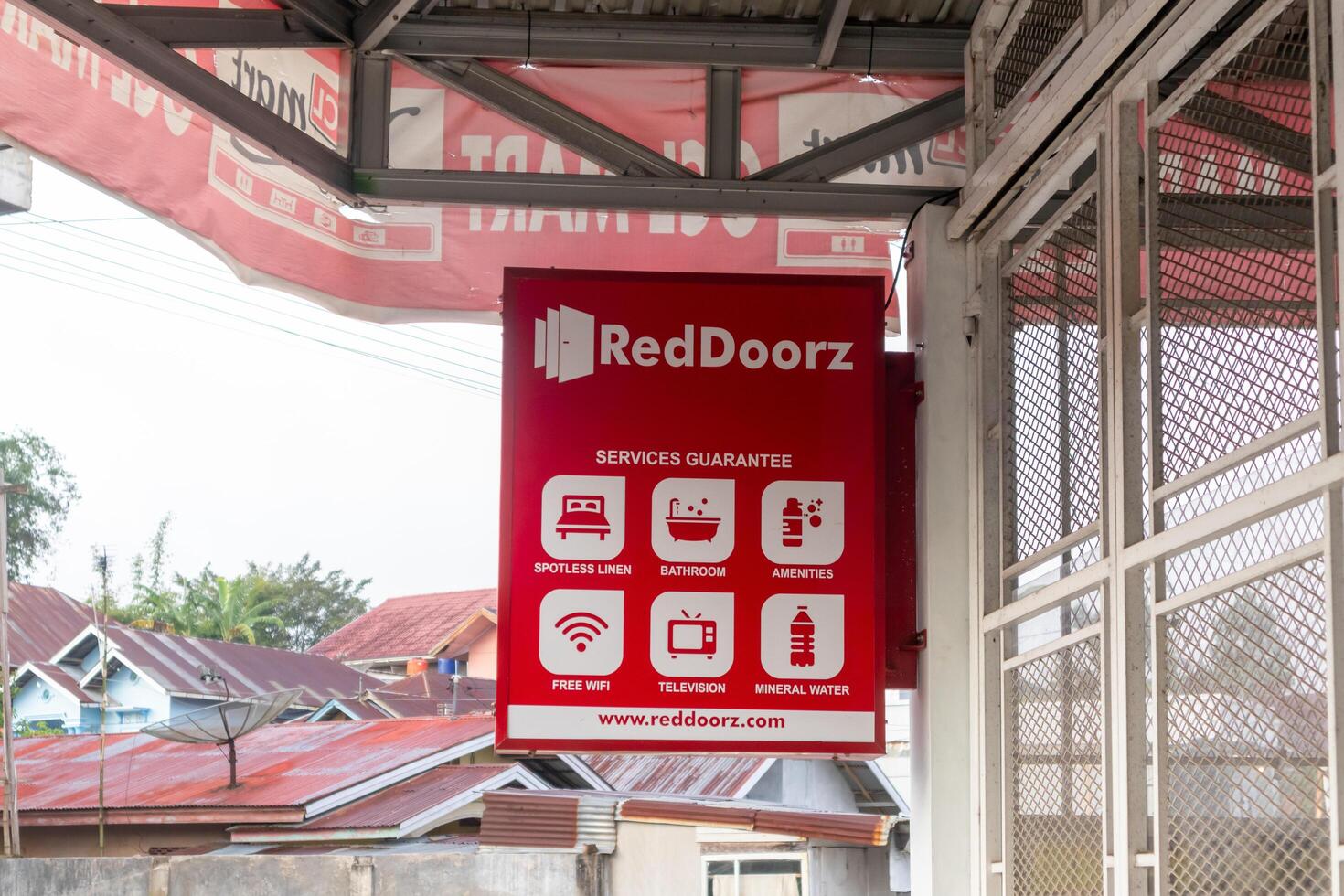 West Sumatra, Indonesia, 2025 - A Reddoorz signboard, a budget hotel or hospitality brand operating in Southeast Asia photo